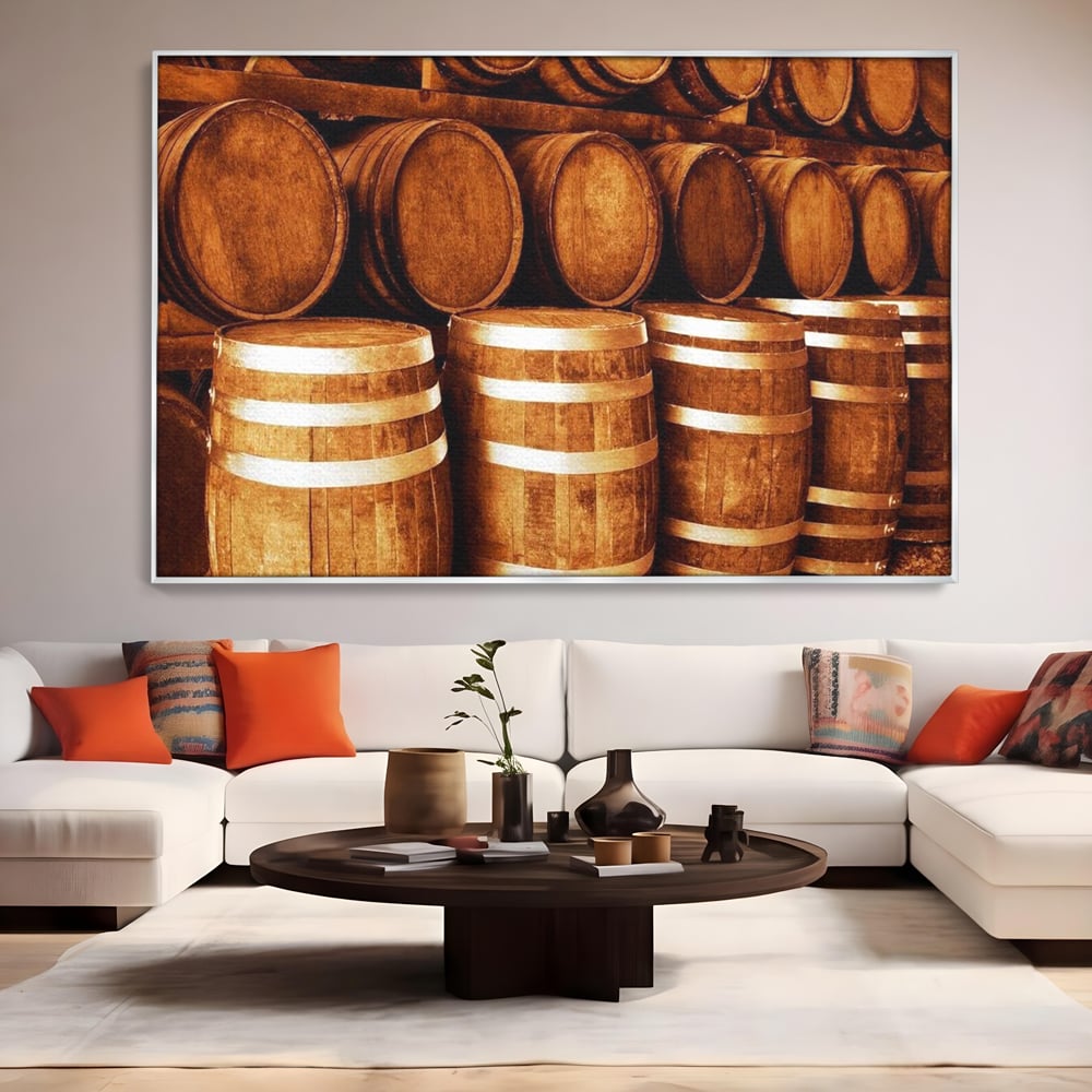 Tablou canvas cu tablou canvas cu butoaie din lemn, in rama de aluminiu argintiu, pe perete intr-un living